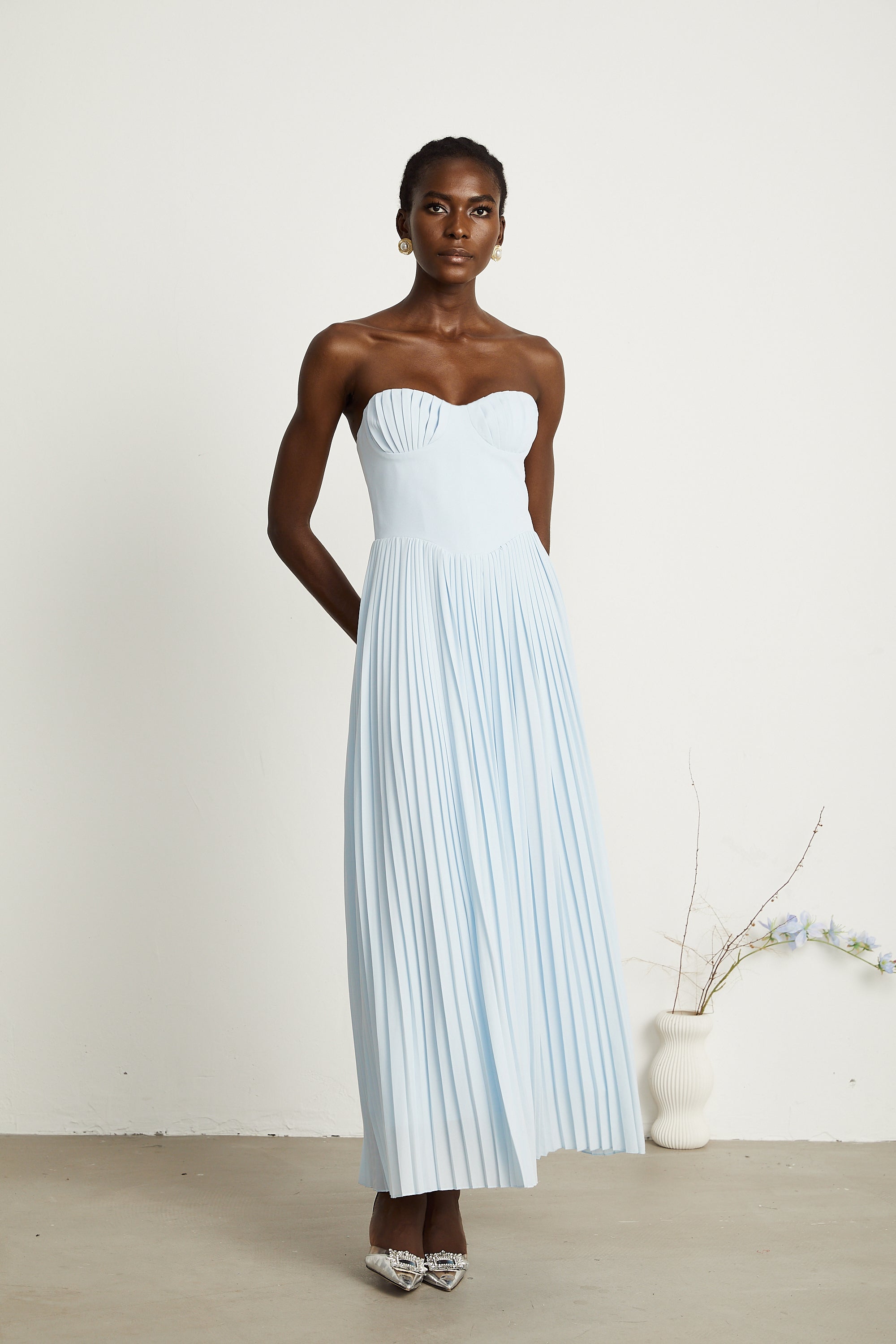 Light blue strapless gown with sweetheart neckline and pleated skirt