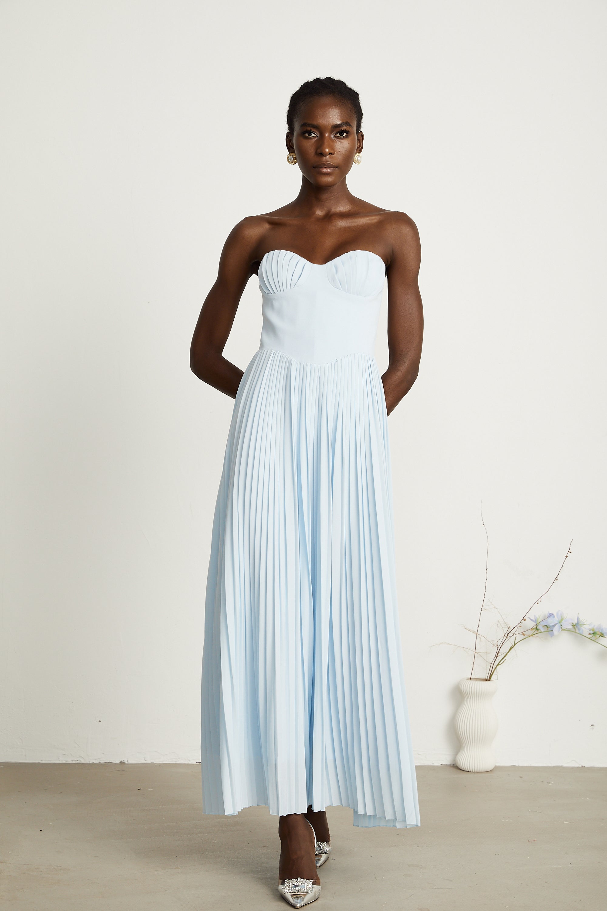 Light blue strapless gown with sweetheart neckline and pleated skirt