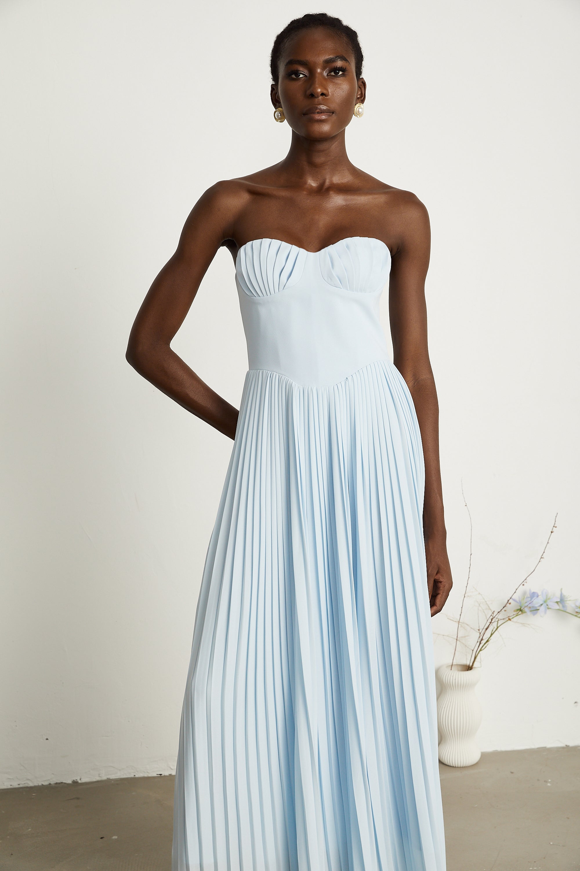 Light blue strapless gown with sweetheart neckline and pleated skirt