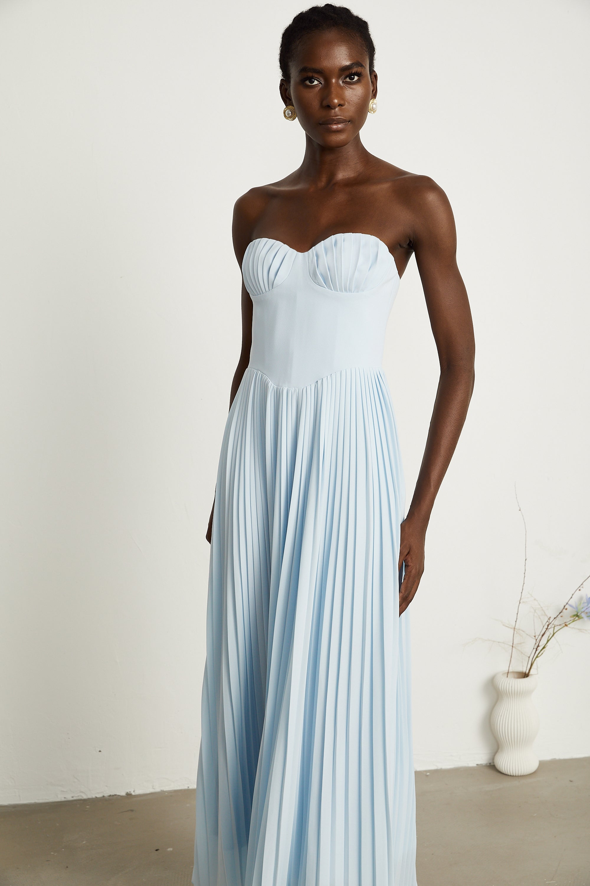 Light blue strapless gown with sweetheart neckline and pleated skirt
