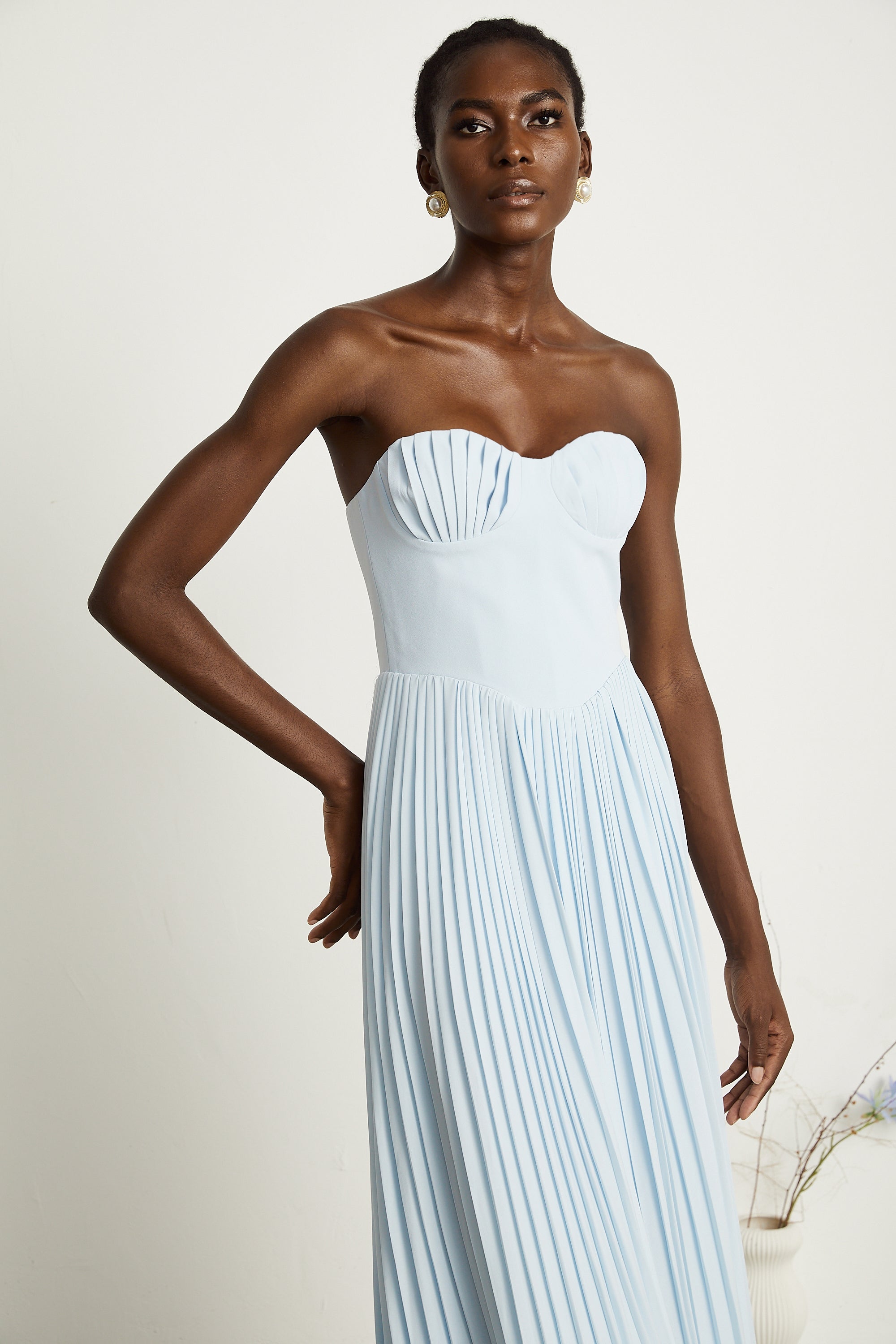 Light blue strapless gown with sweetheart neckline and pleated skirt