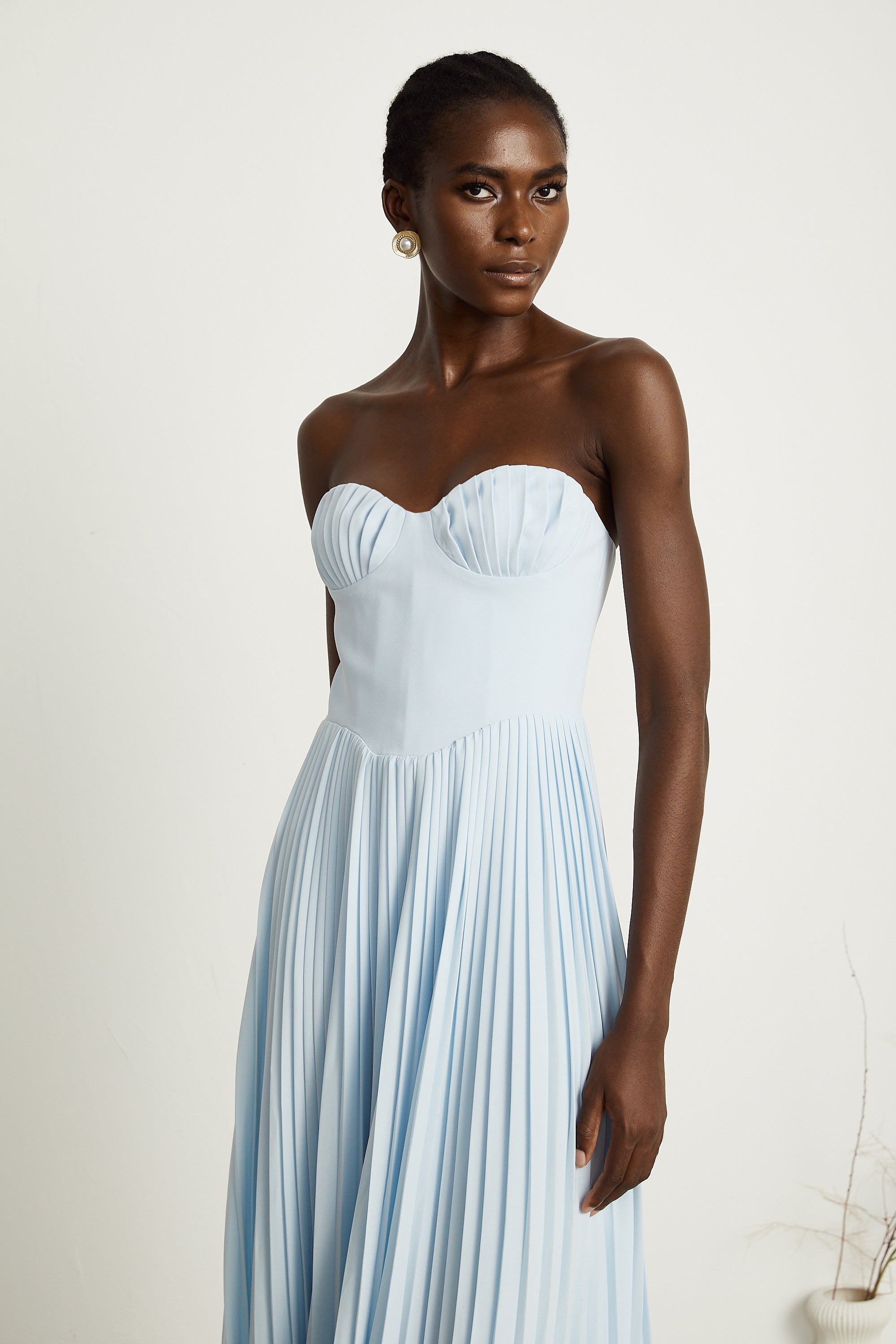Light blue strapless gown with sweetheart neckline and pleated skirt