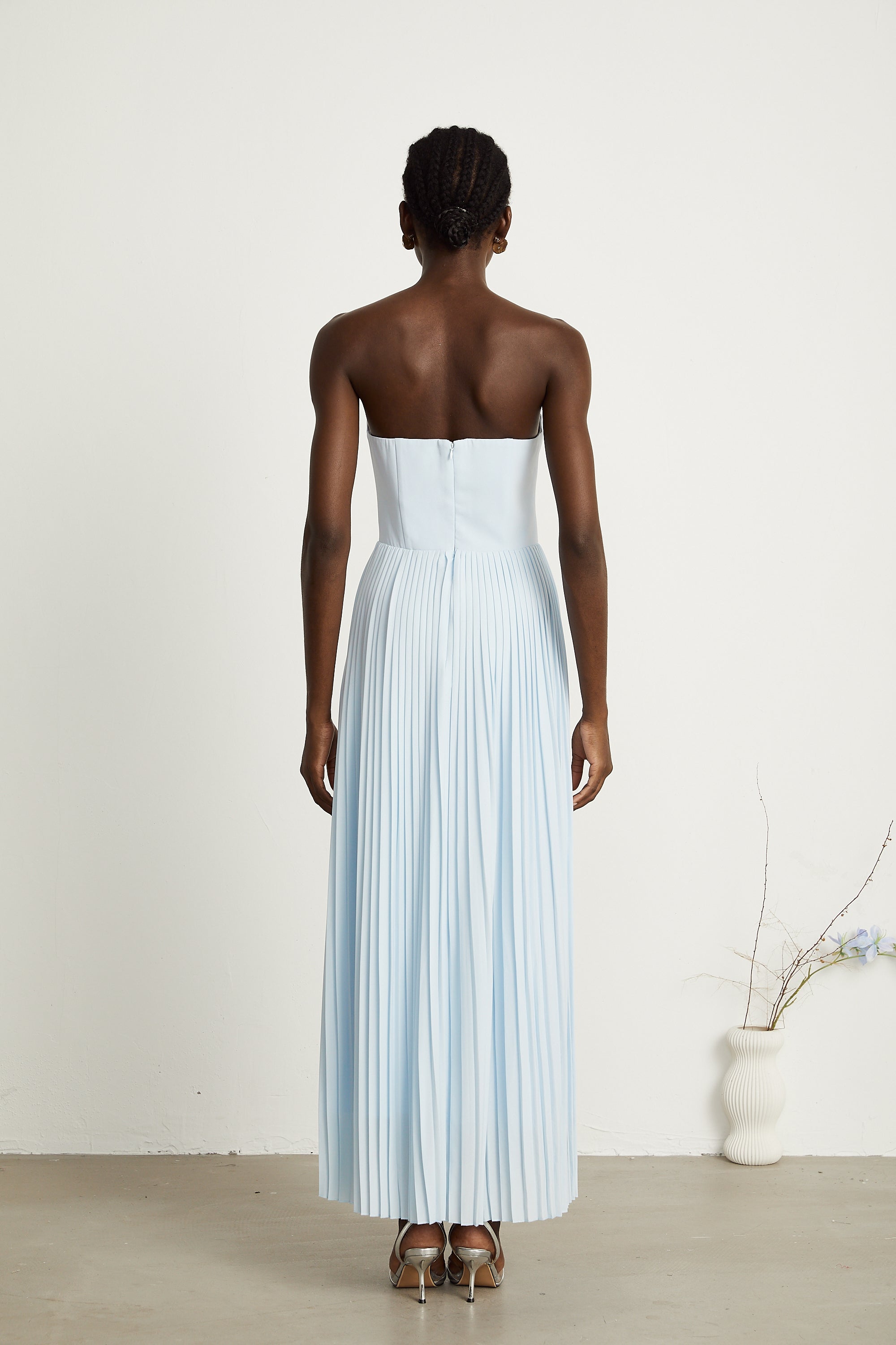 Light blue strapless gown with sweetheart neckline and pleated skirt