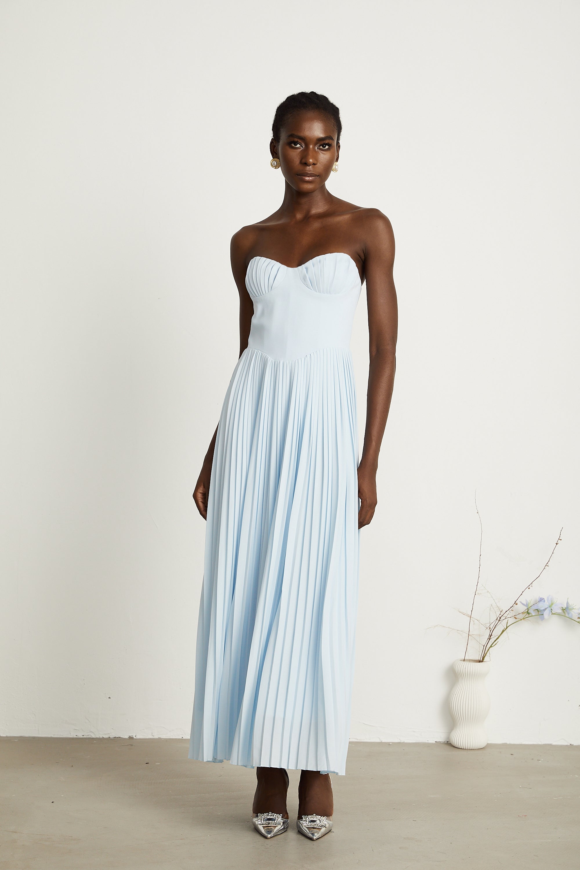 Light blue strapless gown with sweetheart neckline and pleated skirt