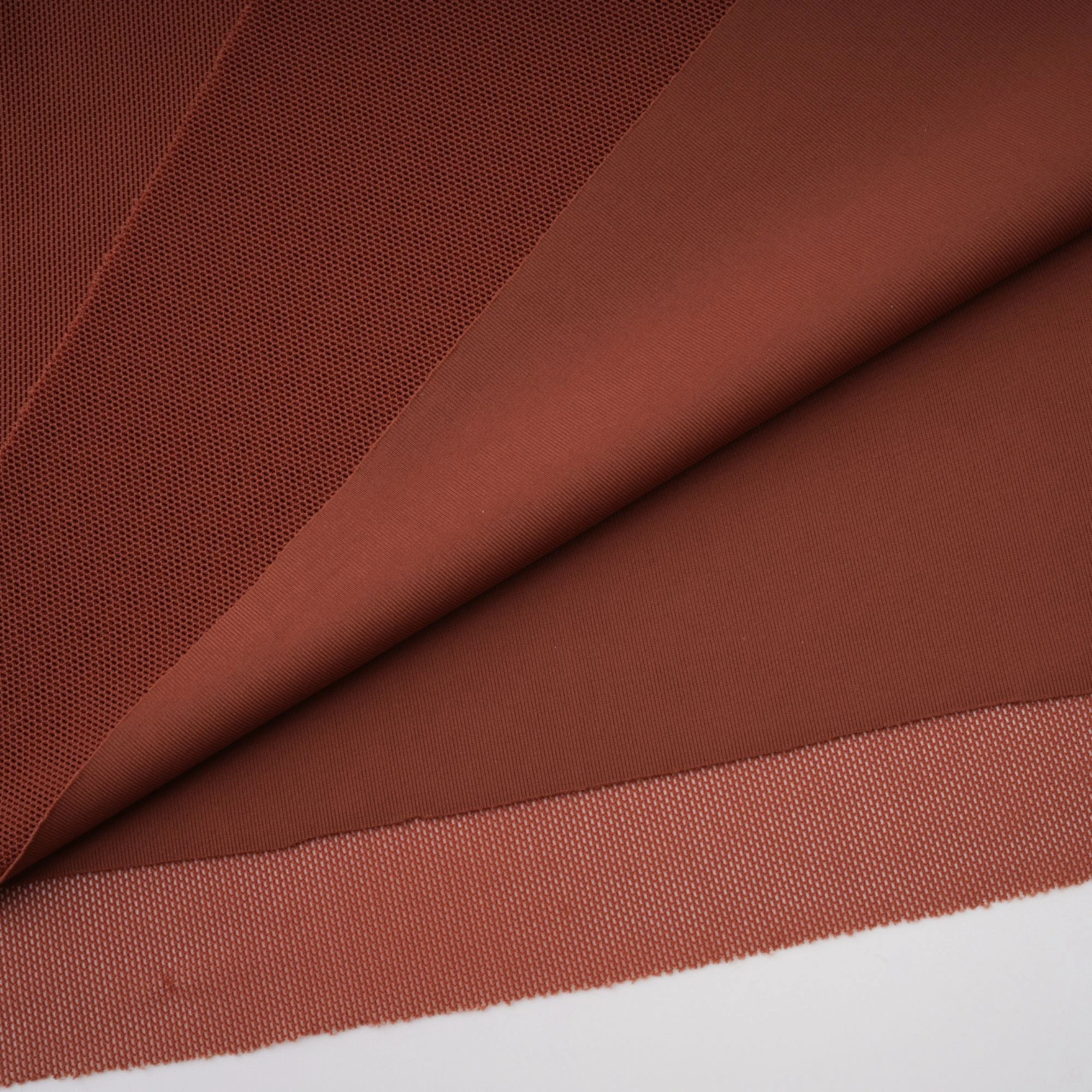 Rust-colored long-sleeve maxi dress with a draped cowl neckline and pleated bodice