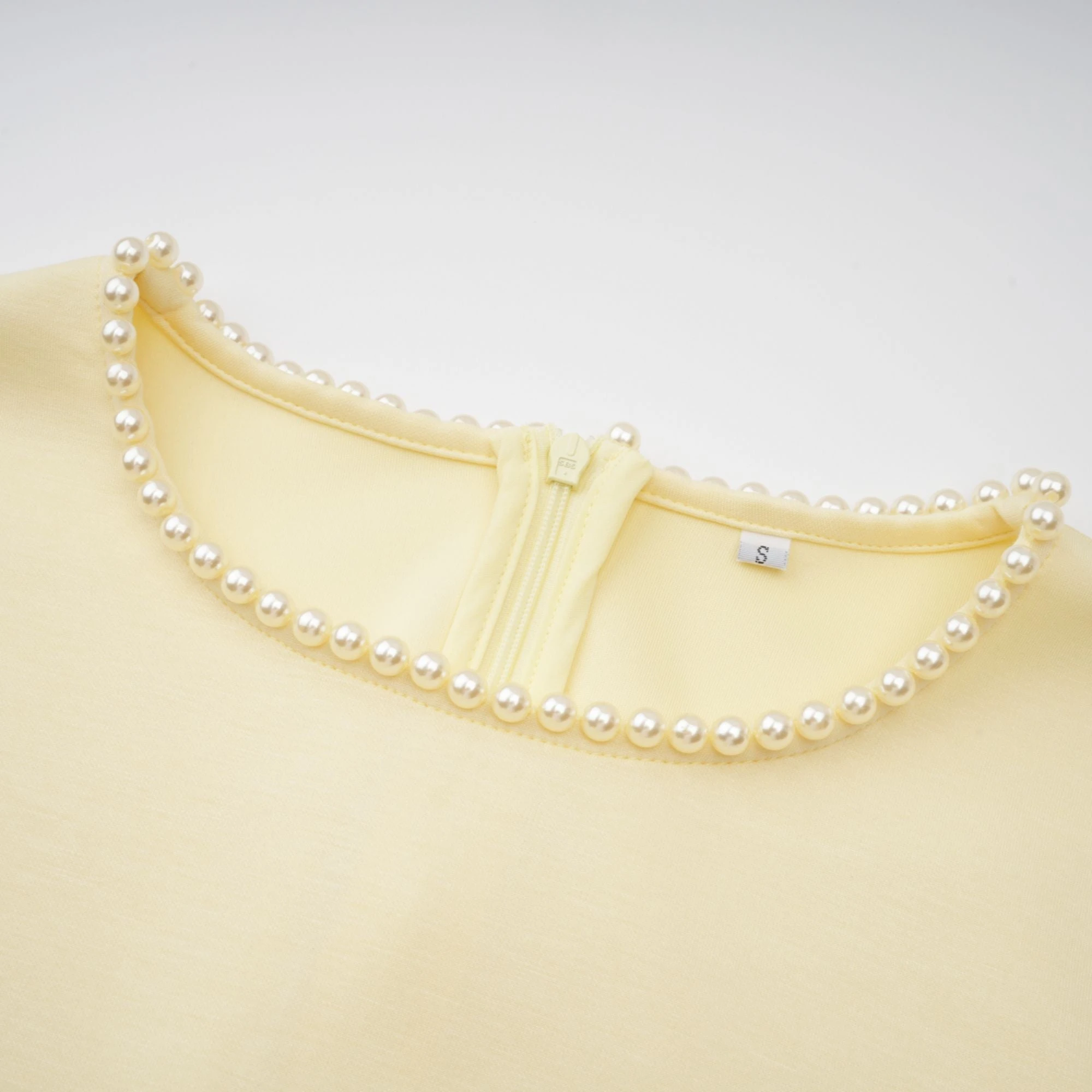 Light yellow long-sleeve maxi dress with a matching beaded cape overlay