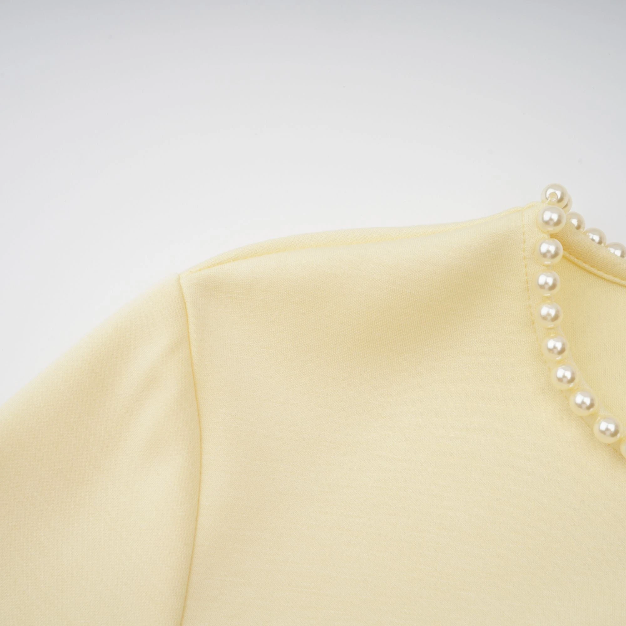 Light yellow long-sleeve maxi dress with a matching beaded cape overlay