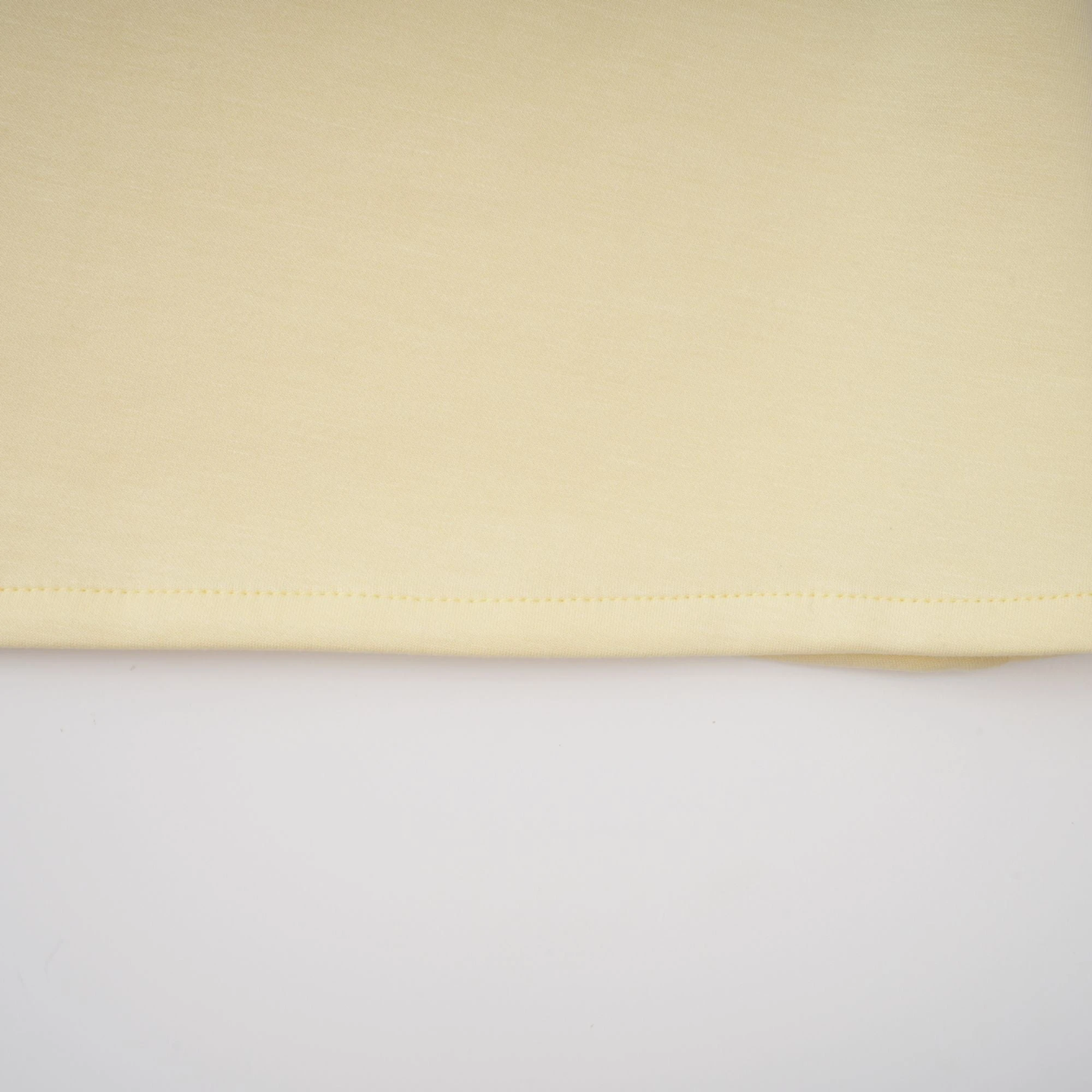 Light yellow long-sleeve maxi dress with a matching beaded cape overlay