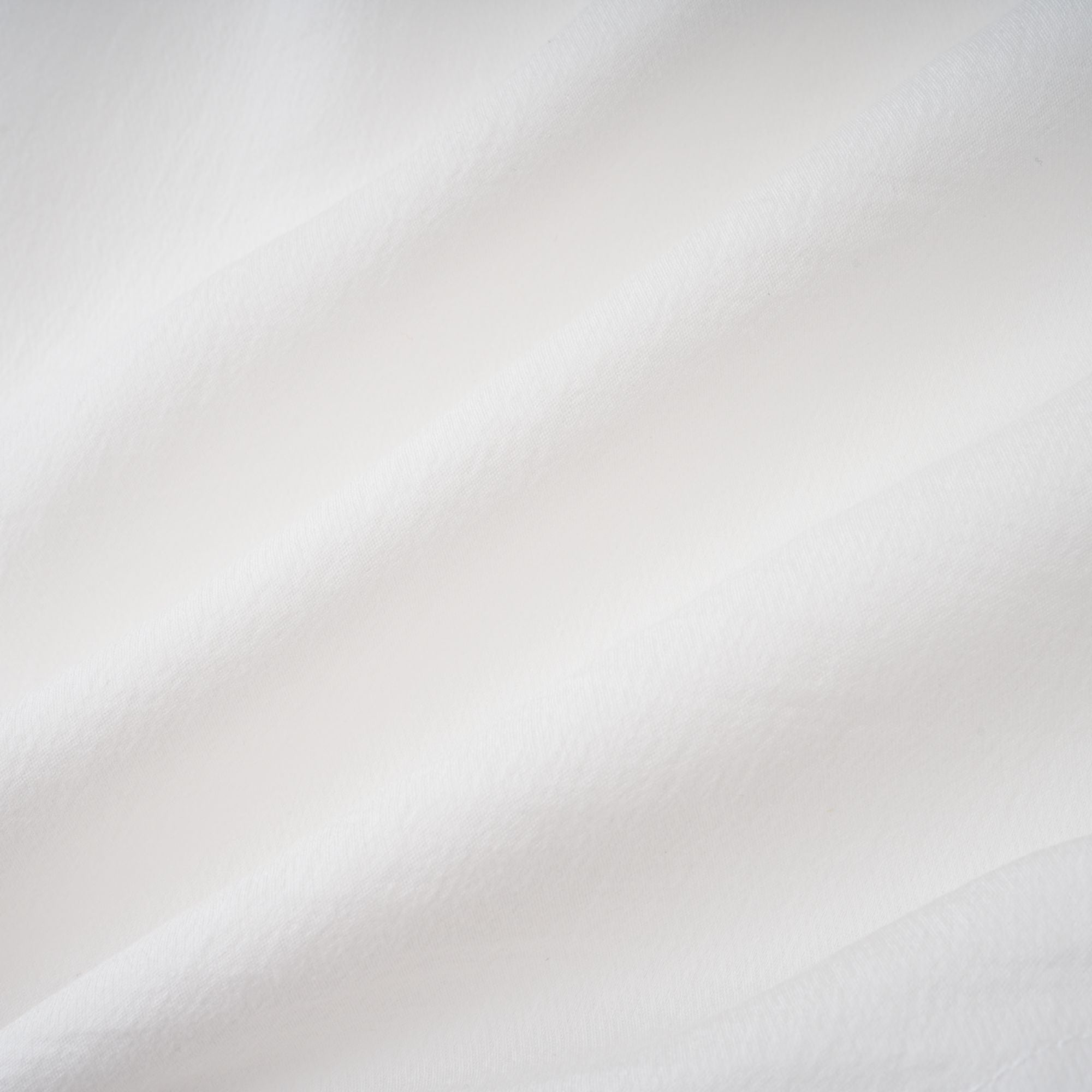 Quincie white shirred flounced mini dress