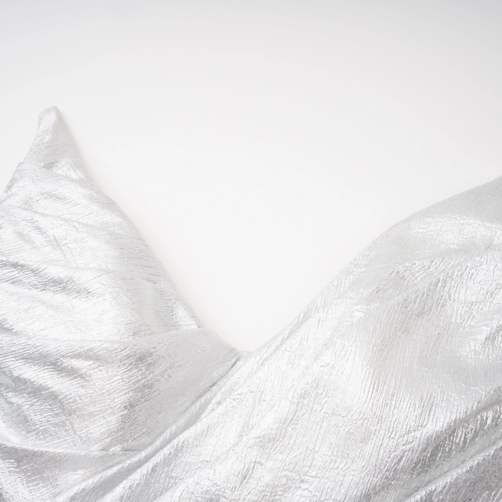 Metallic silver strapless gown with high slit