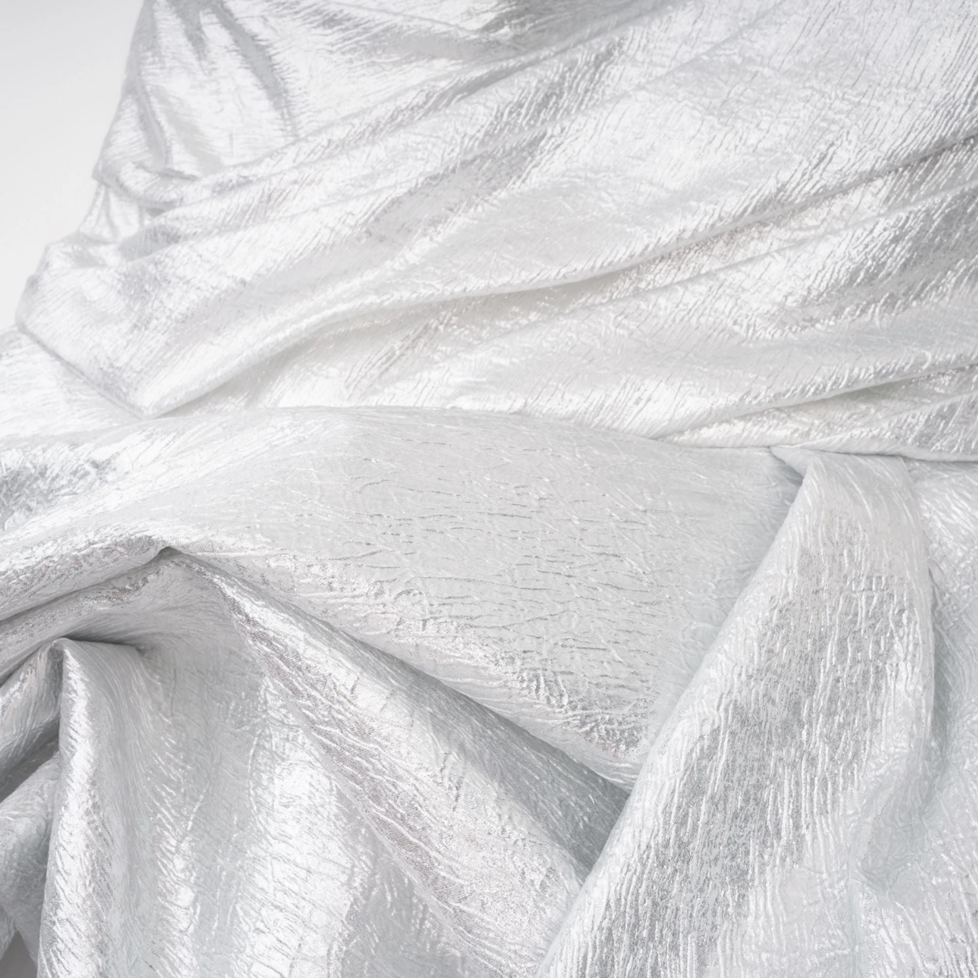 Metallic silver strapless gown with high slit