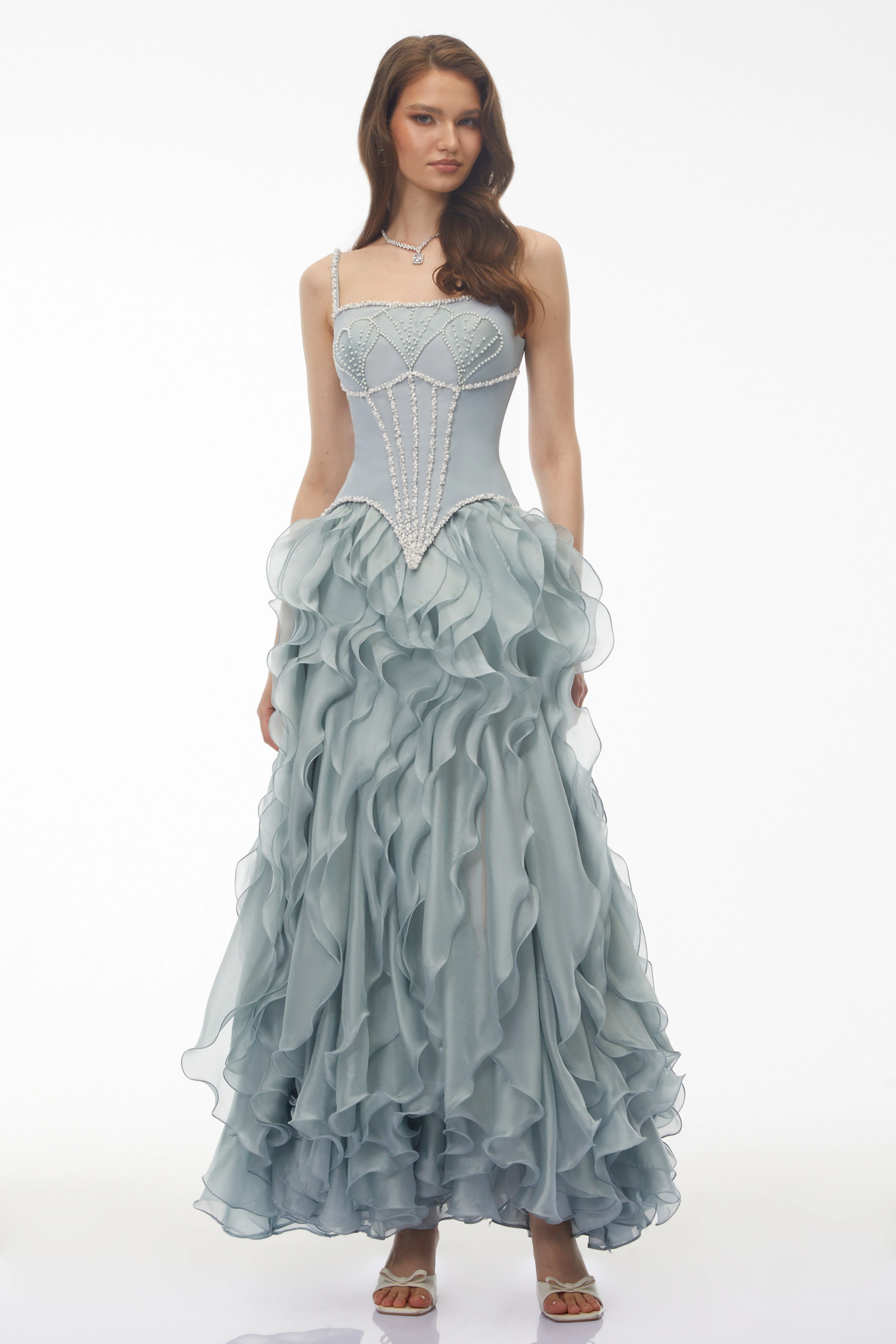 Dusty blue maxi dress with a pearl-embellished corset bodice and a tiered ruffled organza skirt