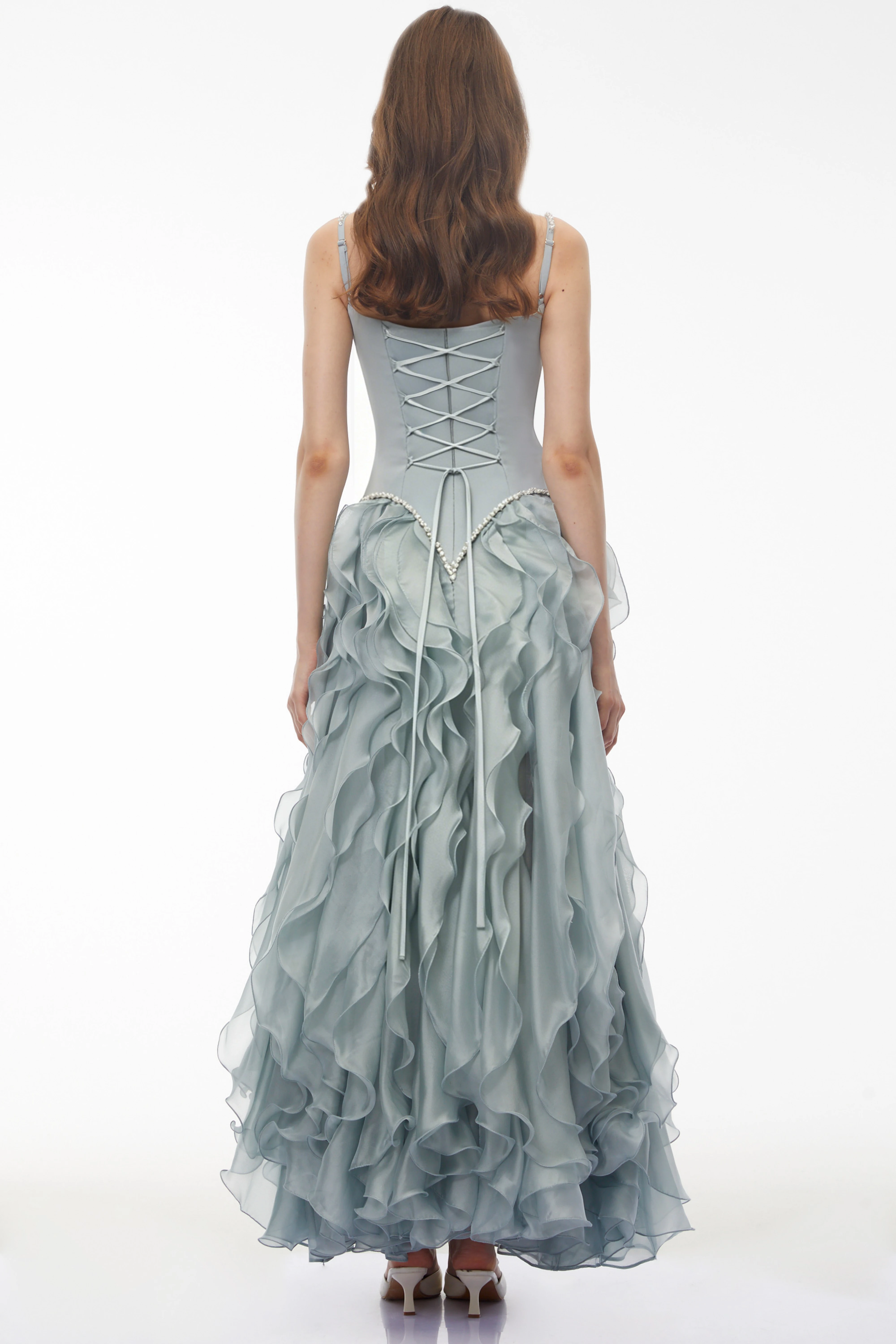 Dusty blue maxi dress with a pearl-embellished corset bodice and a tiered ruffled organza skirt