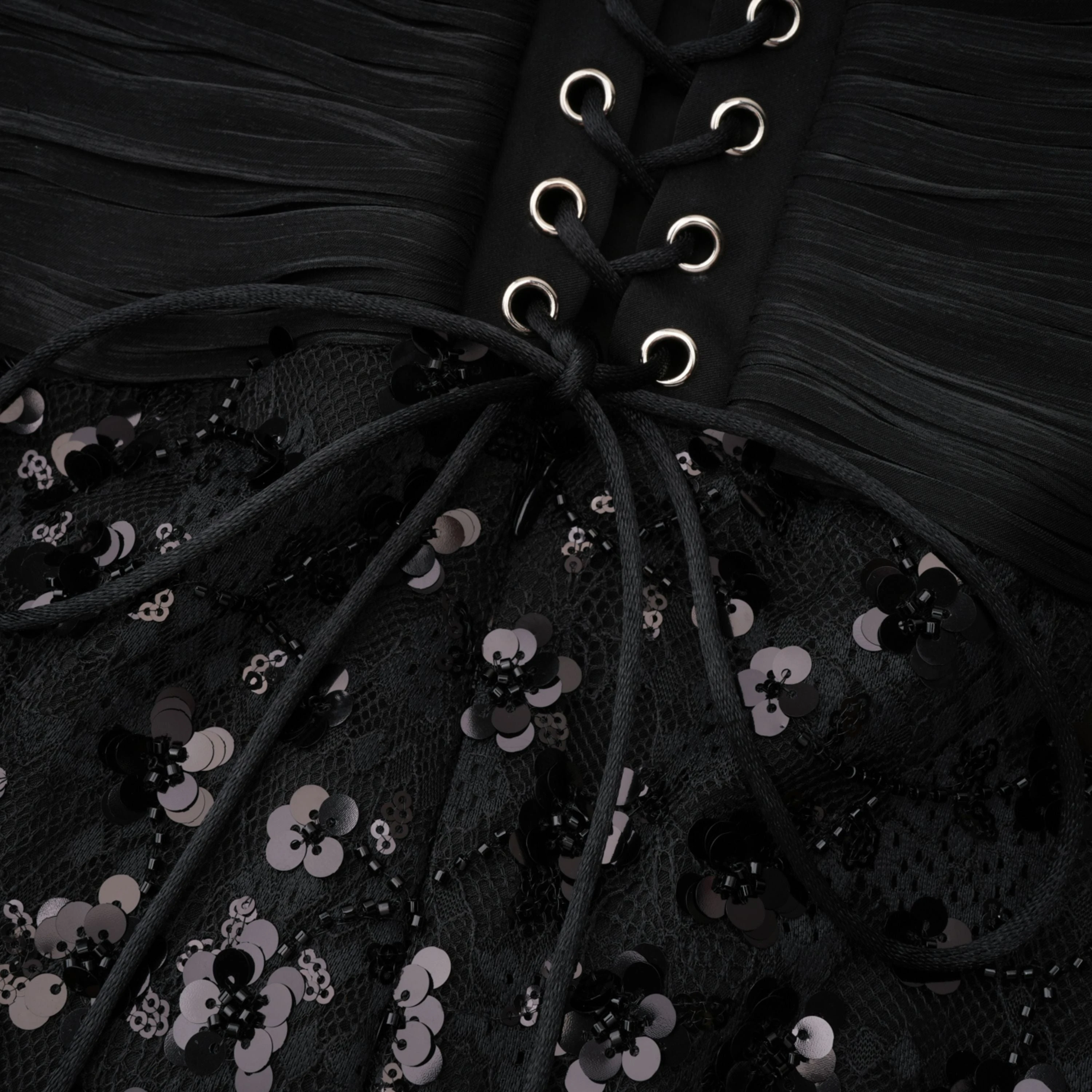 Black halter gown with sequin-embellished lace bodice and hips
