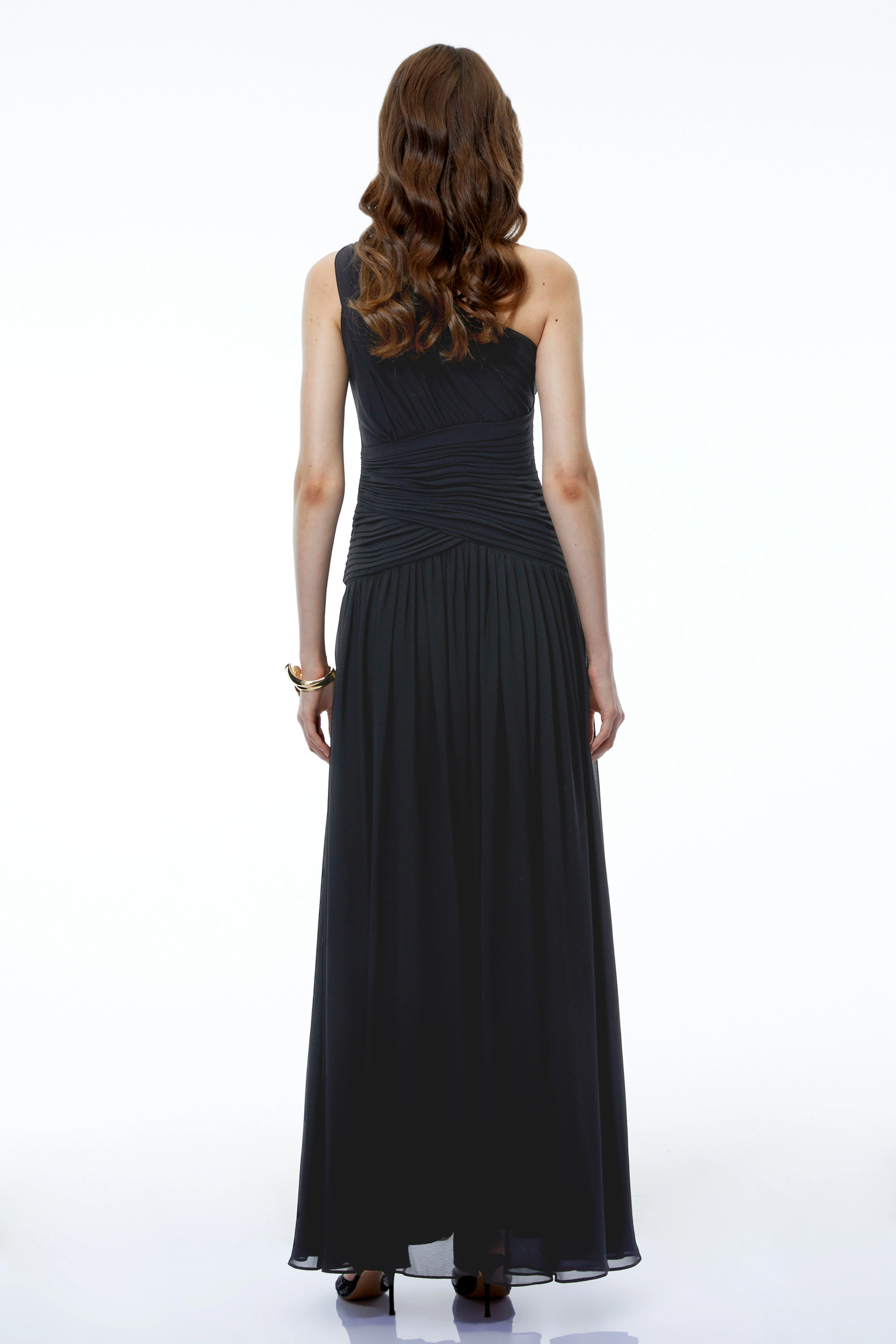 Black one-shoulder maxi dress with a ruched bodice and a high leg slit
